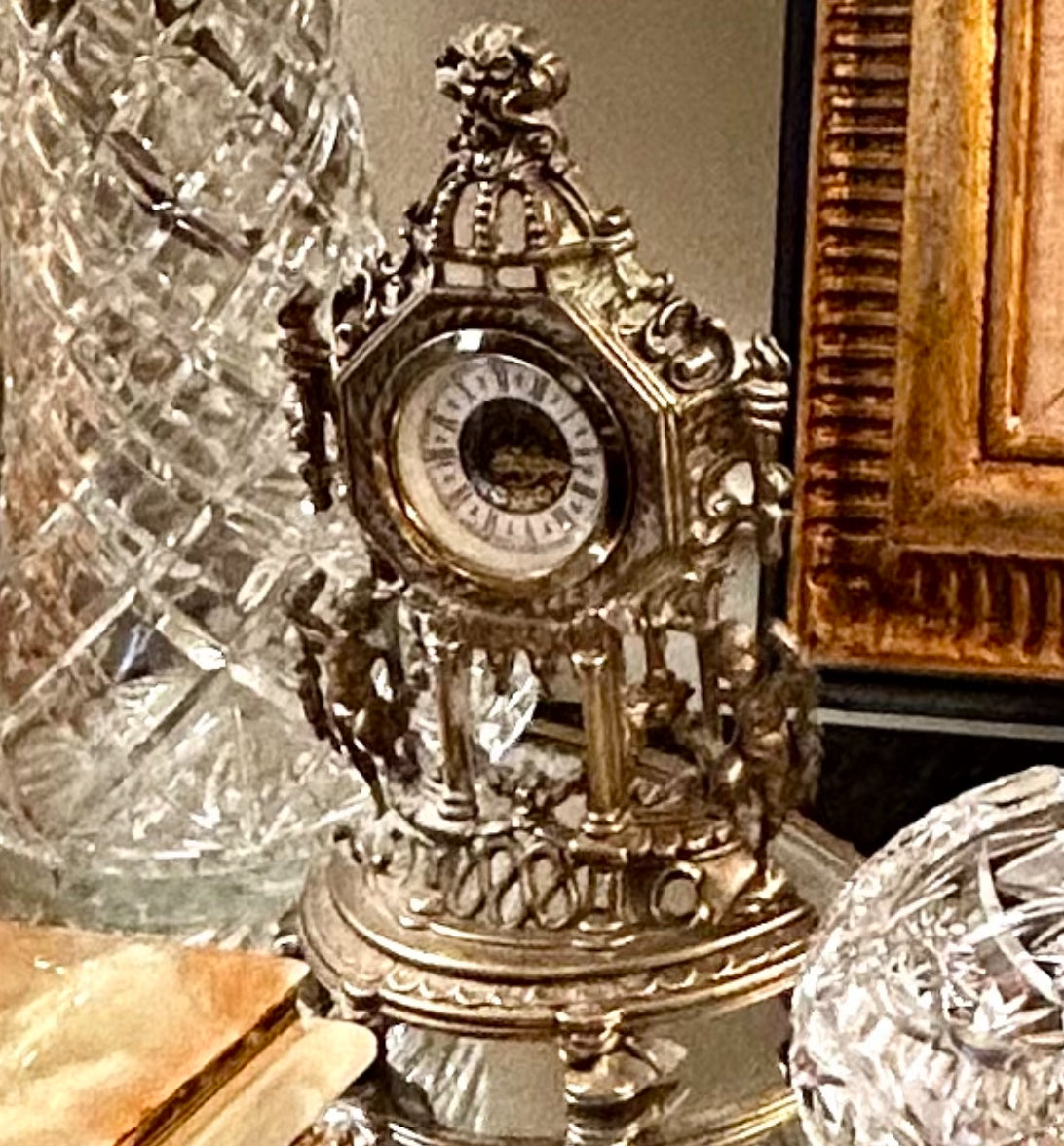 Gorgeous aged mantle clock dripping in details