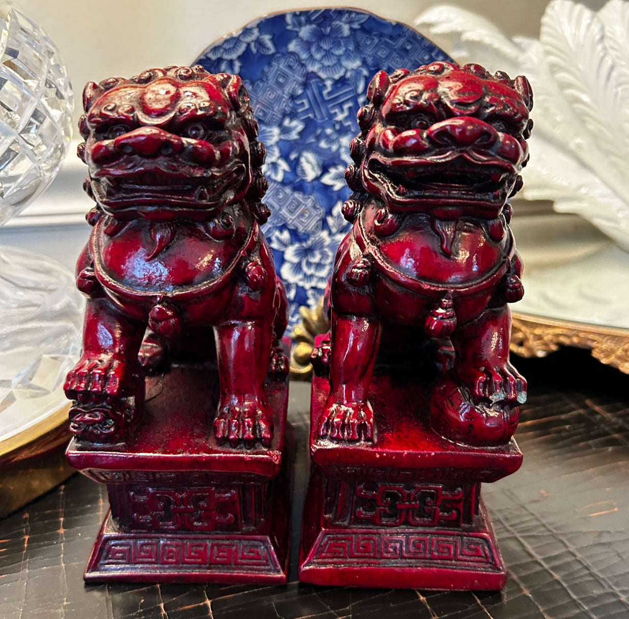 Rich ruby red hand carved older vintage pair of wood foo dog statues