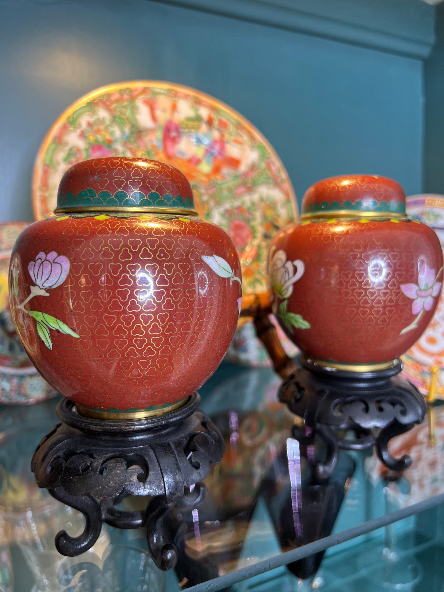 Vintage Pair of Rust Colored Peony Cloisonné Jars on Wood Stands