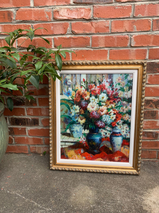 Stunning original bouquet floral art! Showcases beautiful vivid colors with blue and white vases in a ready to be hung ornate frame!