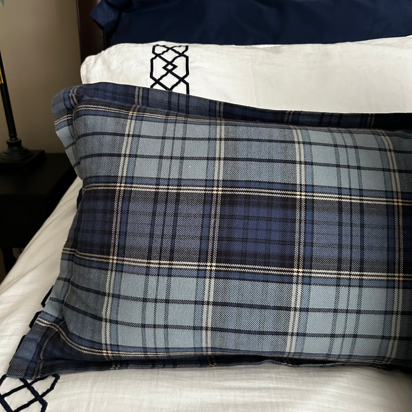 Set of three traditional plaid throw pillows.