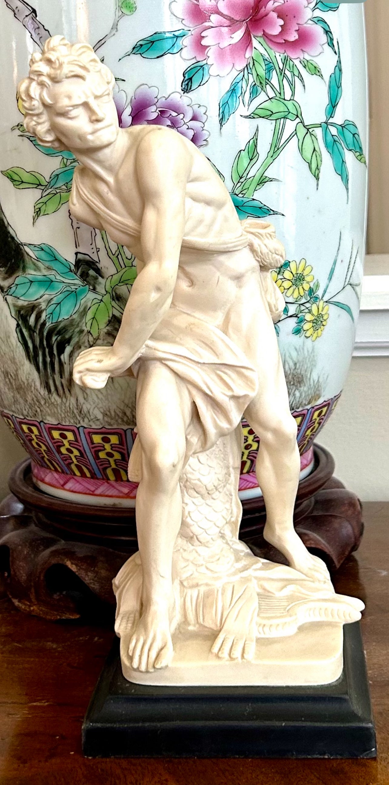 Neoclassical inspired masculine hunter vintage statue in pedestal.