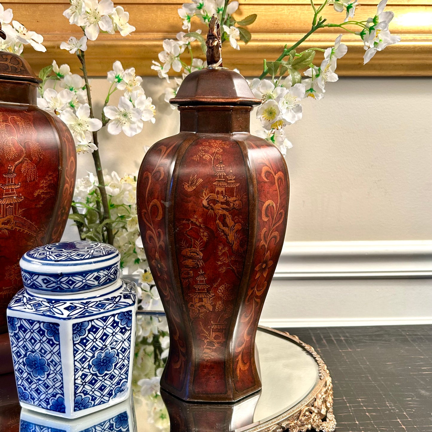 Set of two chinoiserie pagoda statuesque pagoda vases jars plus lids.