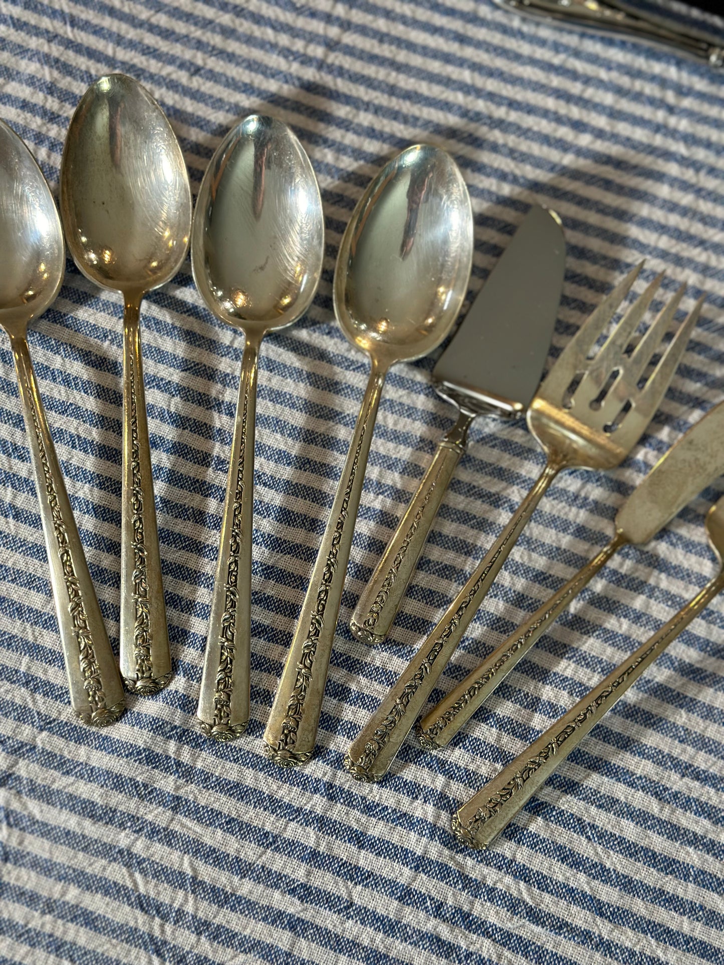 Antique Sterling “Ramker Rose” by Towle. 8 pcs. Total. Butter knife, pie server, (4) serving spoons, (2) meat forks included.