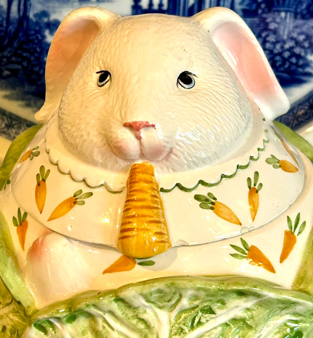 Ample bunny rabbit snuggled in cabbage cookie jar with lid