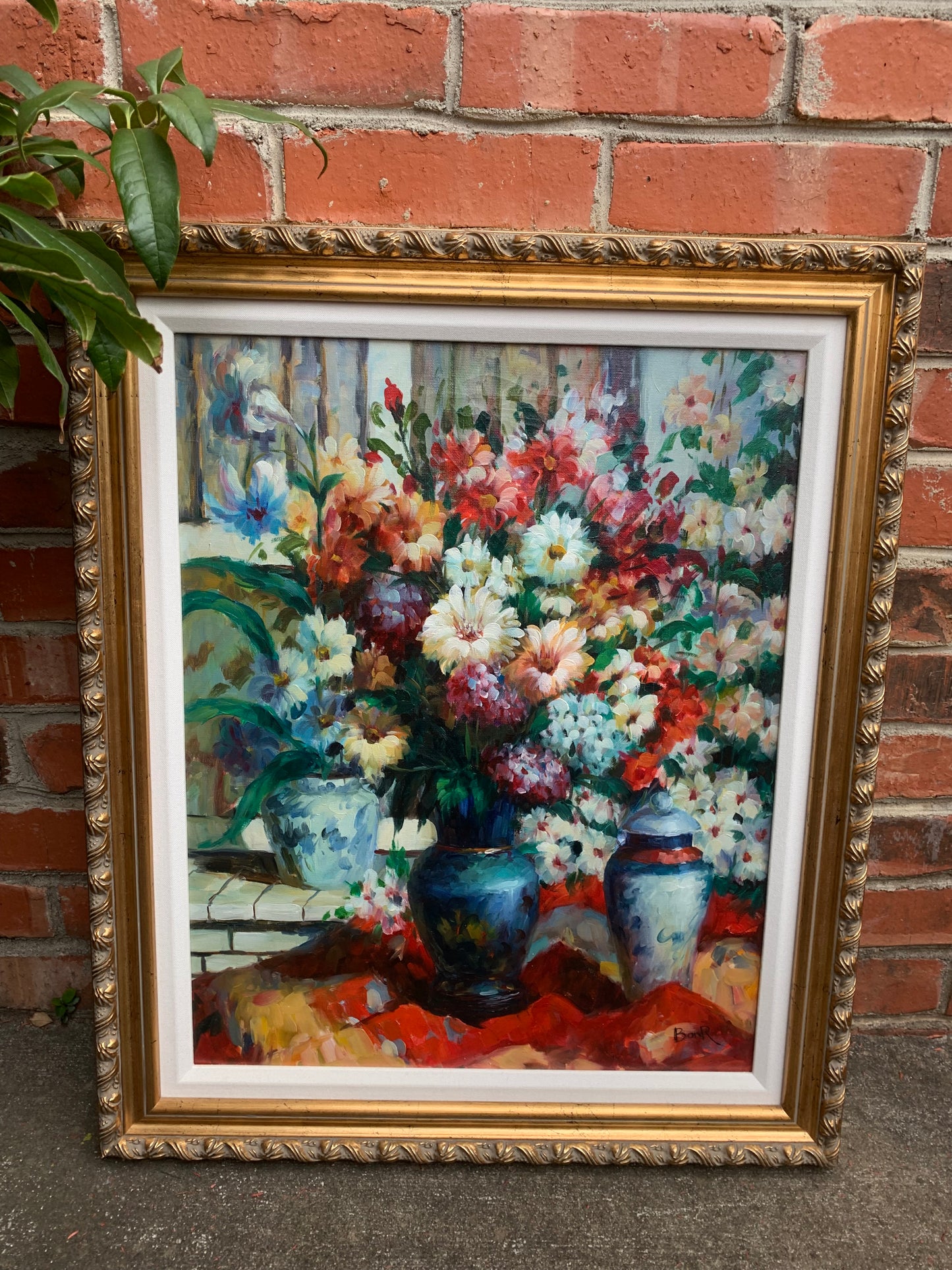 Stunning original bouquet floral art! Showcases beautiful vivid colors with blue and white vases in a ready to be hung ornate frame!