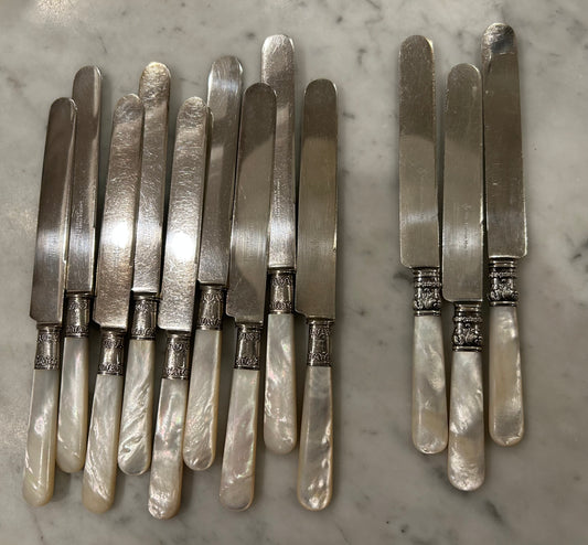 12 Pearl Handled knives All with Sterling Bands!  9 are the Same and 3 are little different, but all Beautiful!