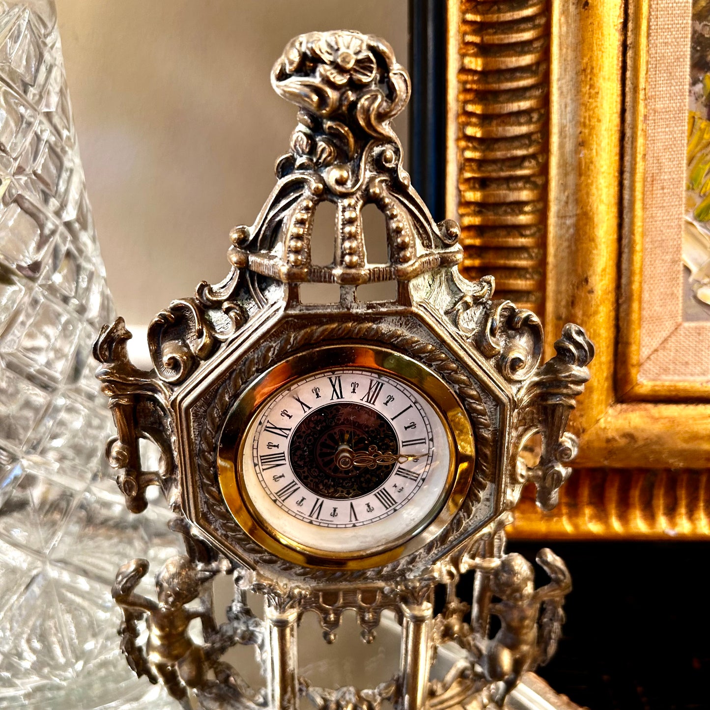 Gorgeous aged mantle clock dripping in details