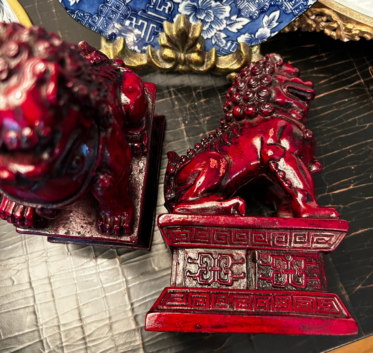 Rich ruby red hand carved older vintage pair of wood foo dog statues