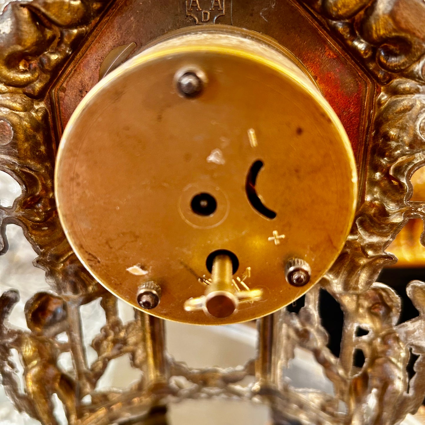 Gorgeous aged mantle clock dripping in details