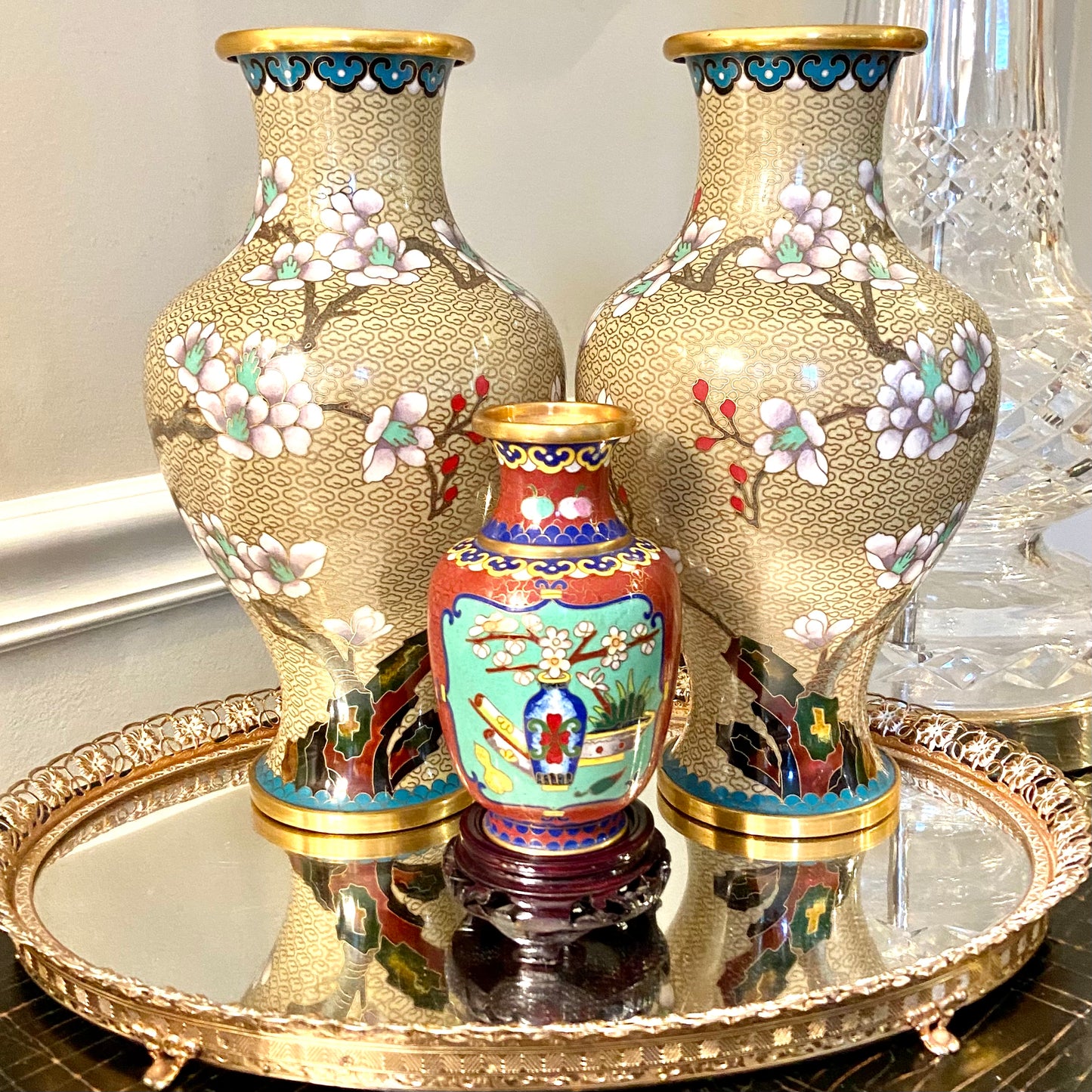 Vibrant vintage brass cloisonné vase on wood stand