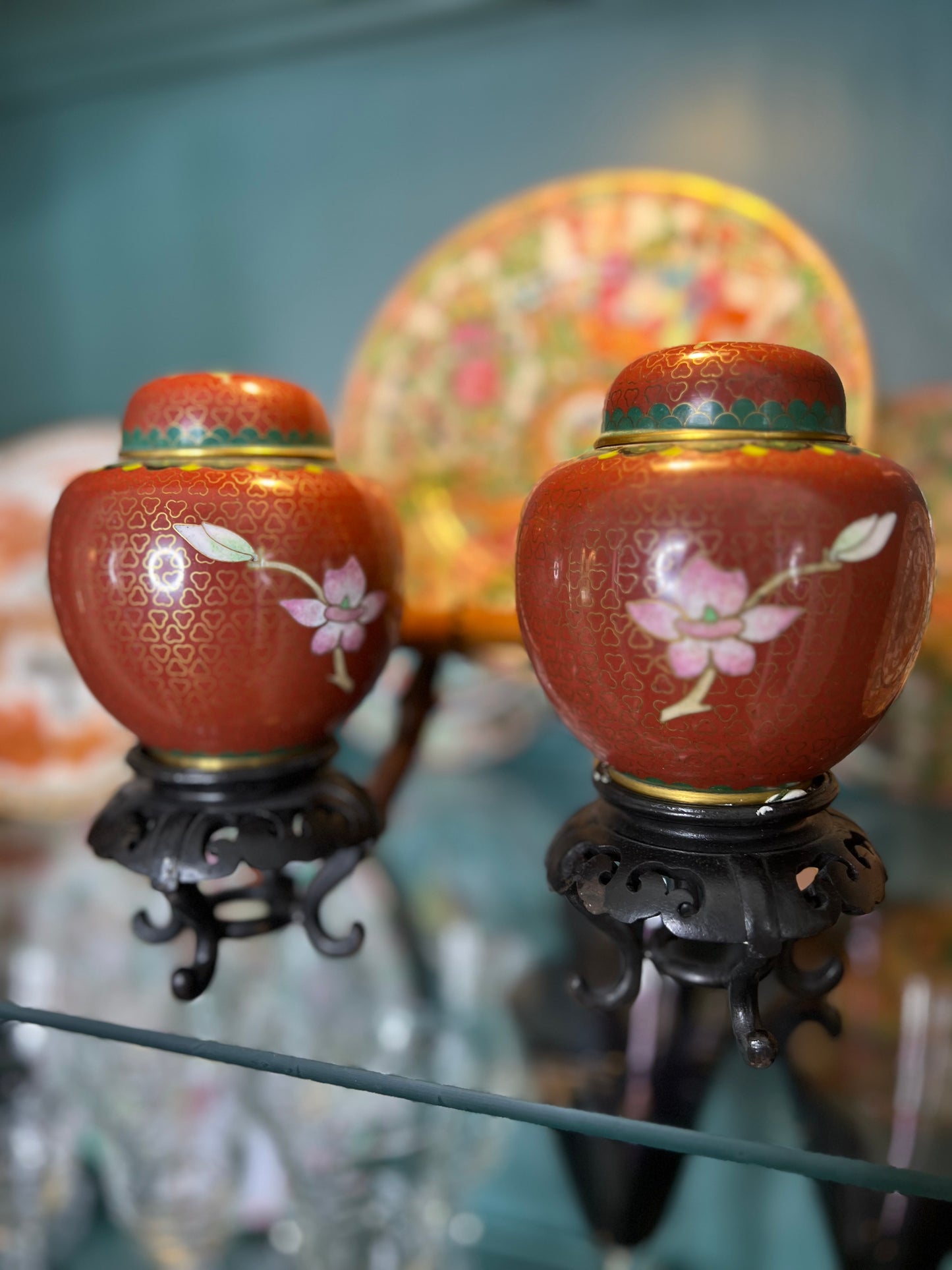 Vintage Pair of Rust Colored Peony Cloisonné Jars on Wood Stands