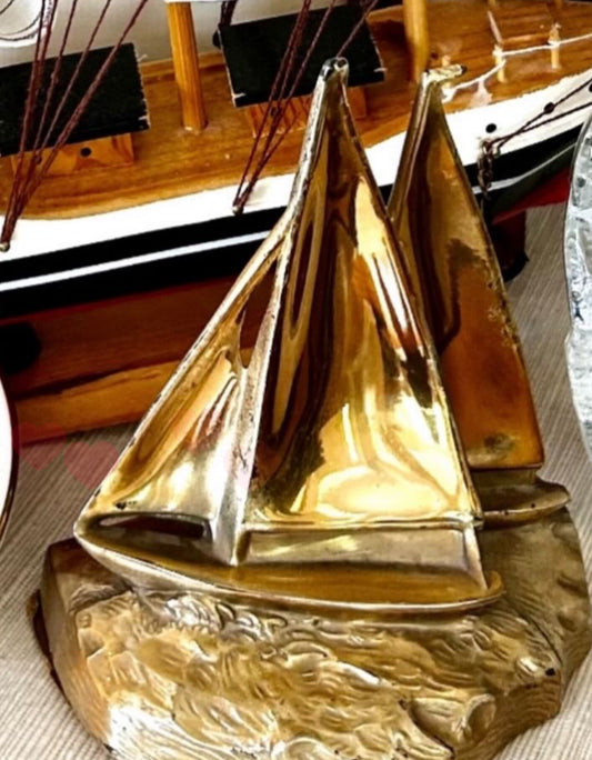 Shiny vintage brass boat bookend decor