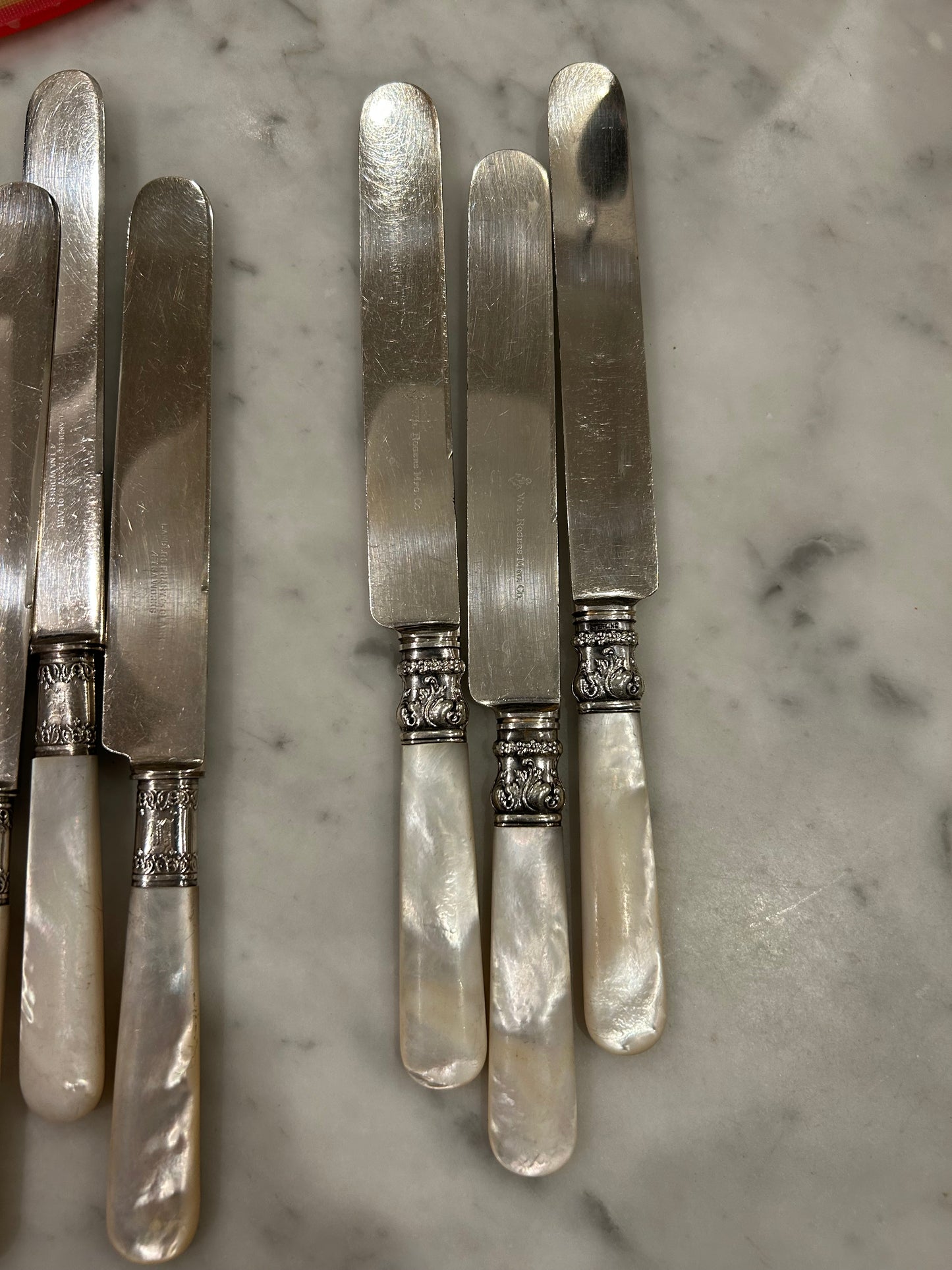 12 Pearl Handled knives All with Sterling Bands!  9 are the Same and 3 are little different, but all Beautiful!