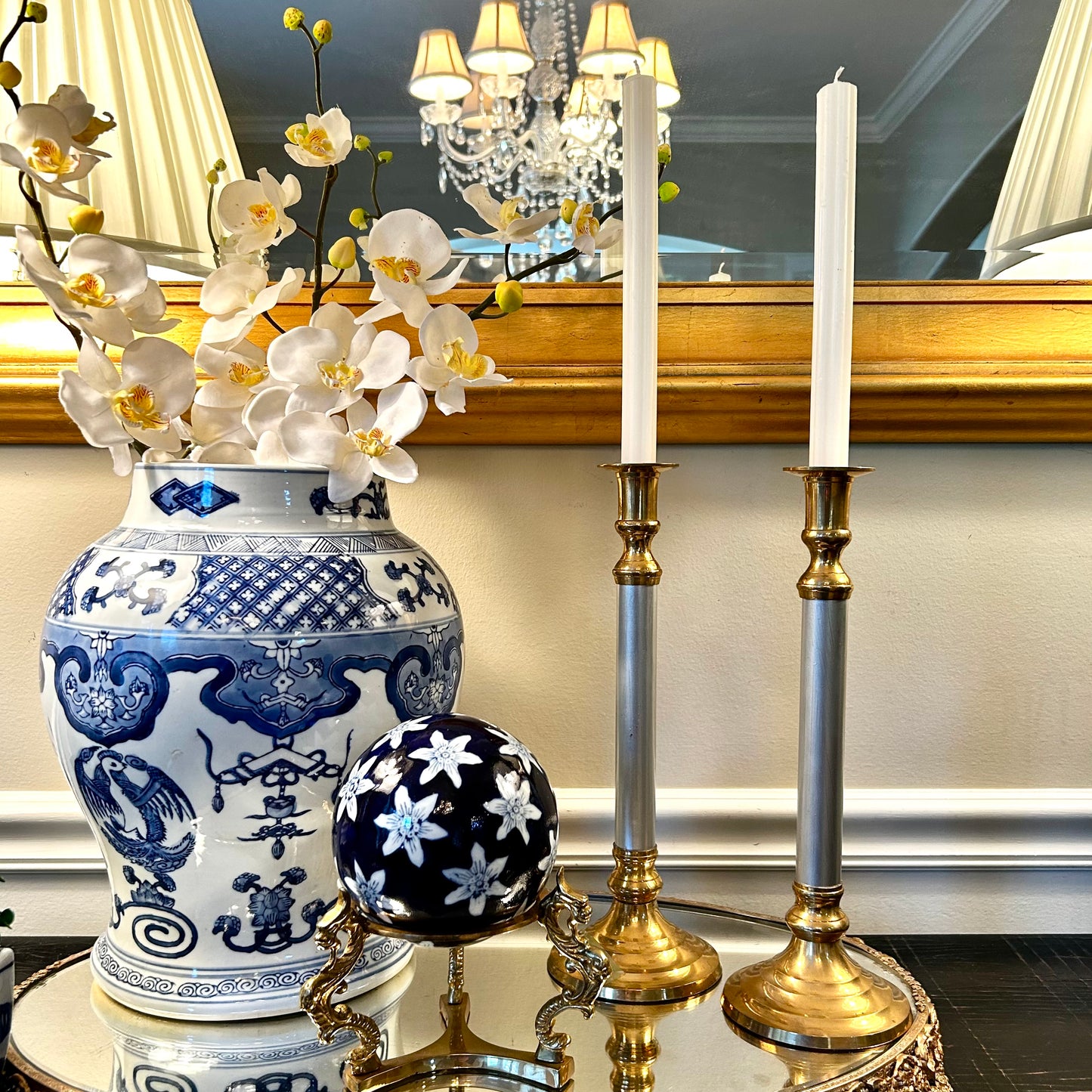 Pair of statuesque mid century brass and silver plate candlestick holders