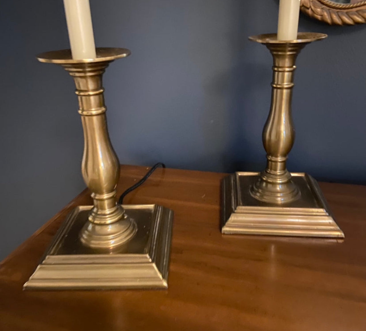 Pair of statuesque  brass candlestick style lamps