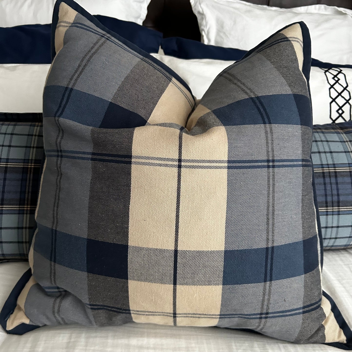 Set of three traditional plaid throw pillows.