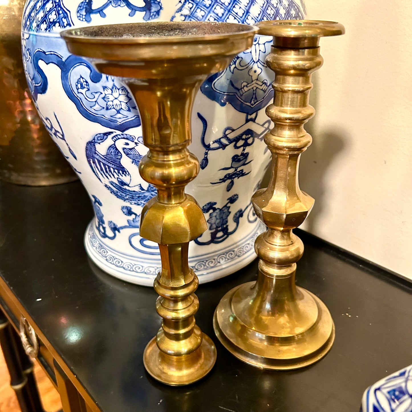 Classic pair of heavy brass candlestick holders .