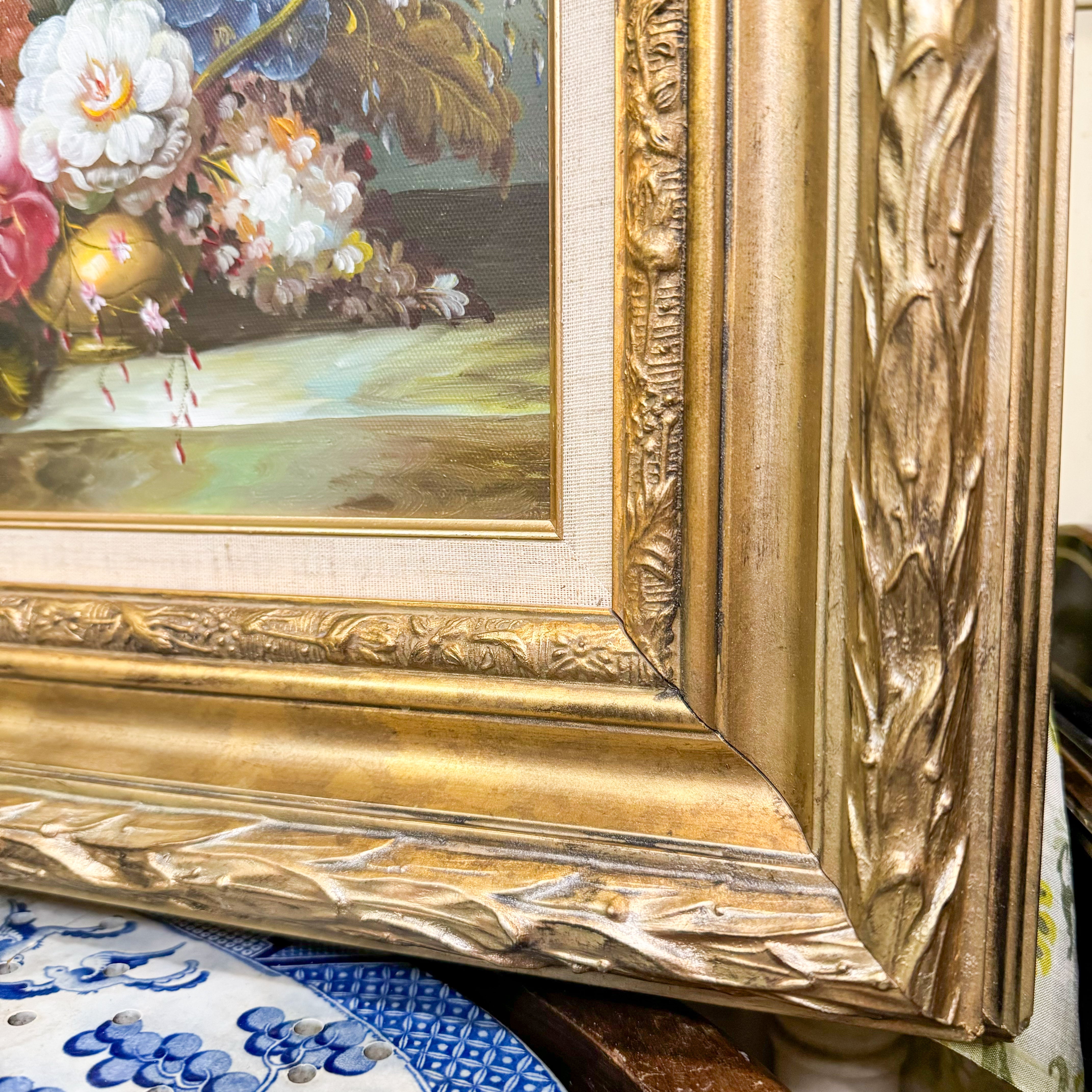 Delightful antique floral oil painting sold on canvas in chippy gilt frame