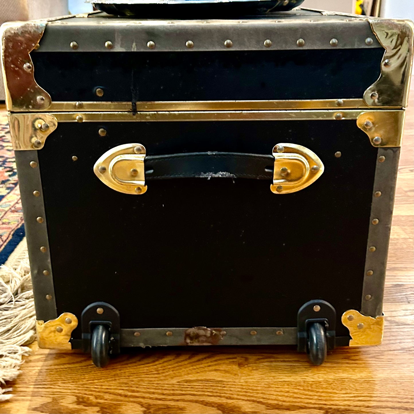 Handsome vintage  ebony black, Brass & leather storage trunk w handles steamer trunk coffee table .