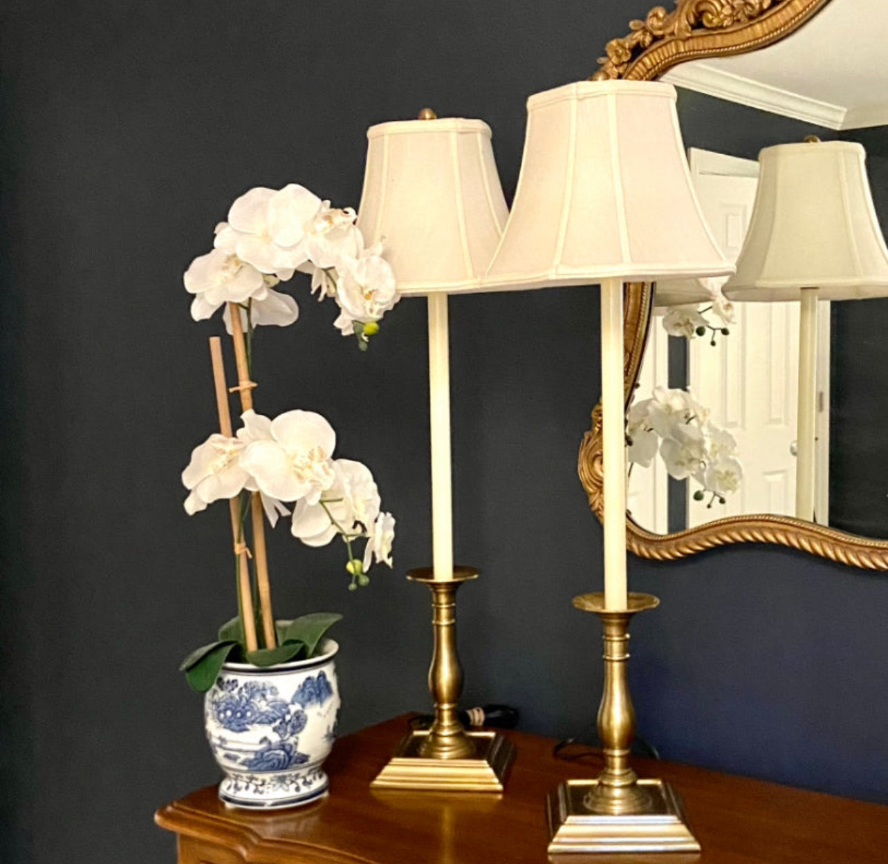 Pair of statuesque  brass candlestick style lamps