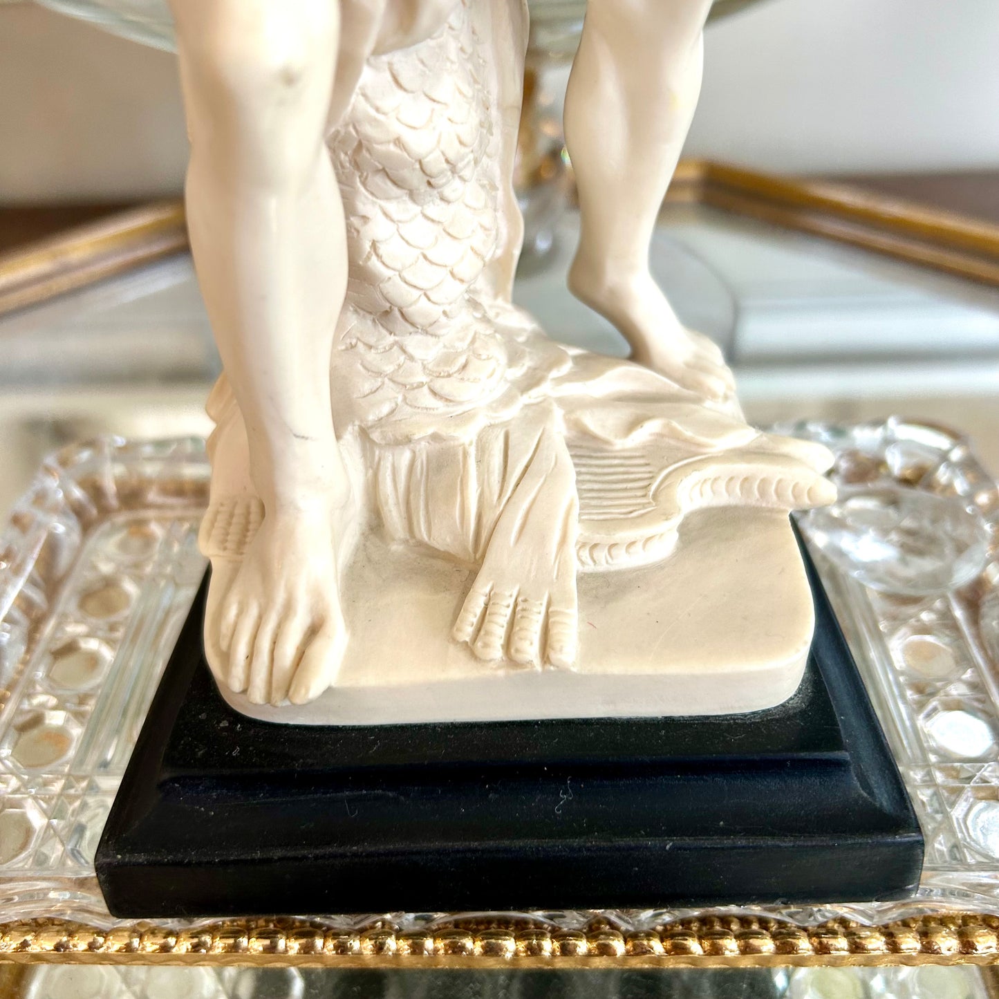 Neoclassical inspired masculine hunter vintage statue in pedestal.