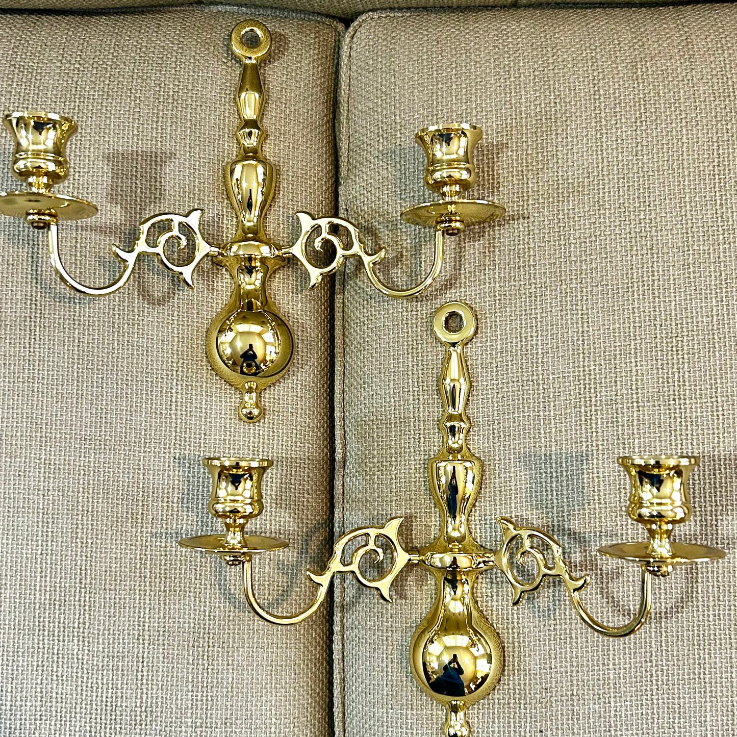 Stunning pair of Hollywood Regency brass double wall candelabras.