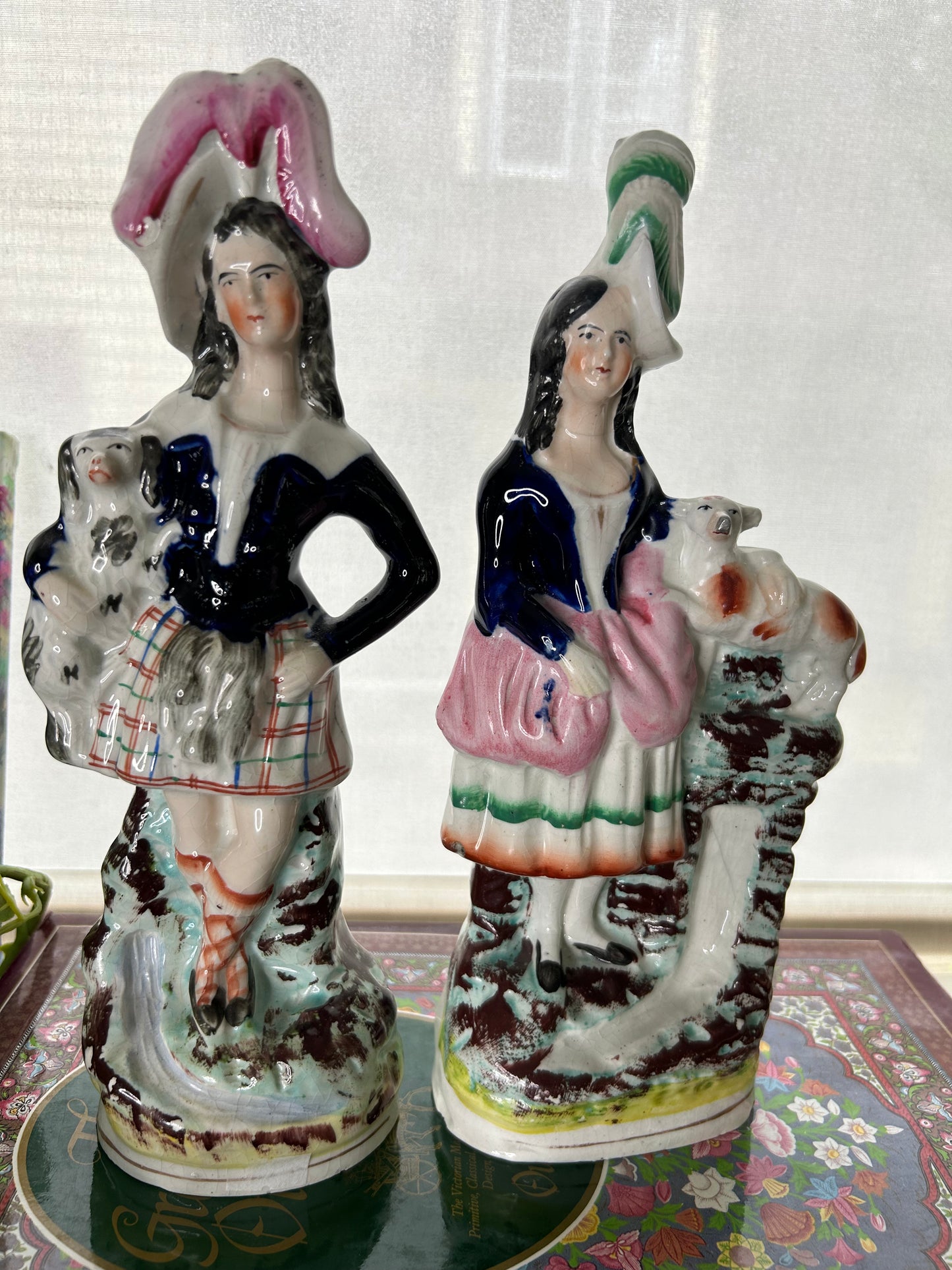 Gorgeous Pair of Staffordshire figures one holding a black and white spaniel, the other holding a Lamb! 11” tall