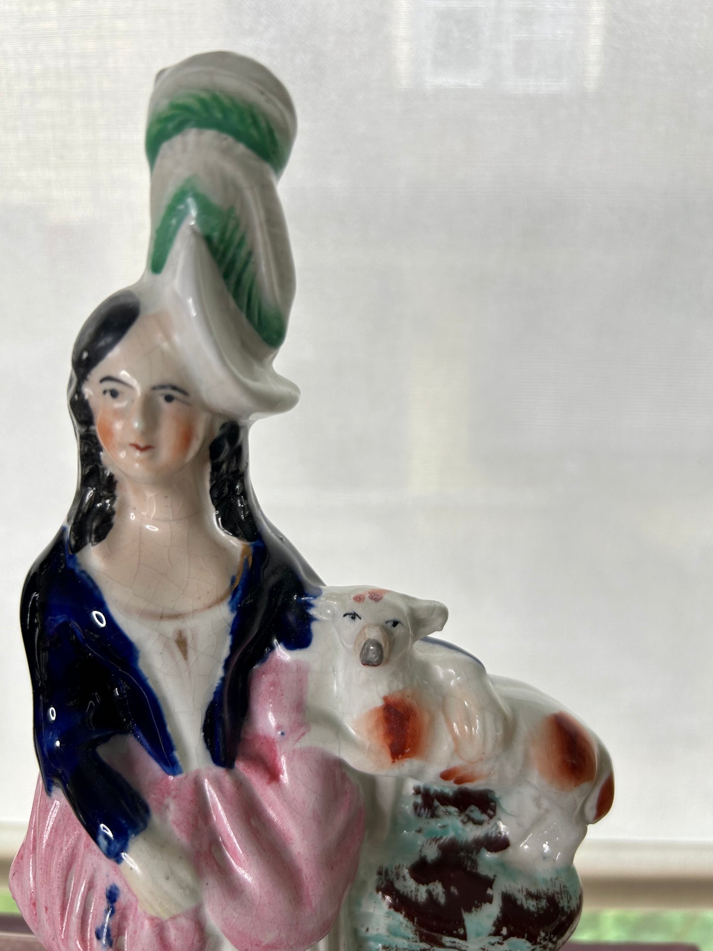 Gorgeous Pair of Staffordshire figures one holding a black and white spaniel, the other holding a Lamb! 11” tall