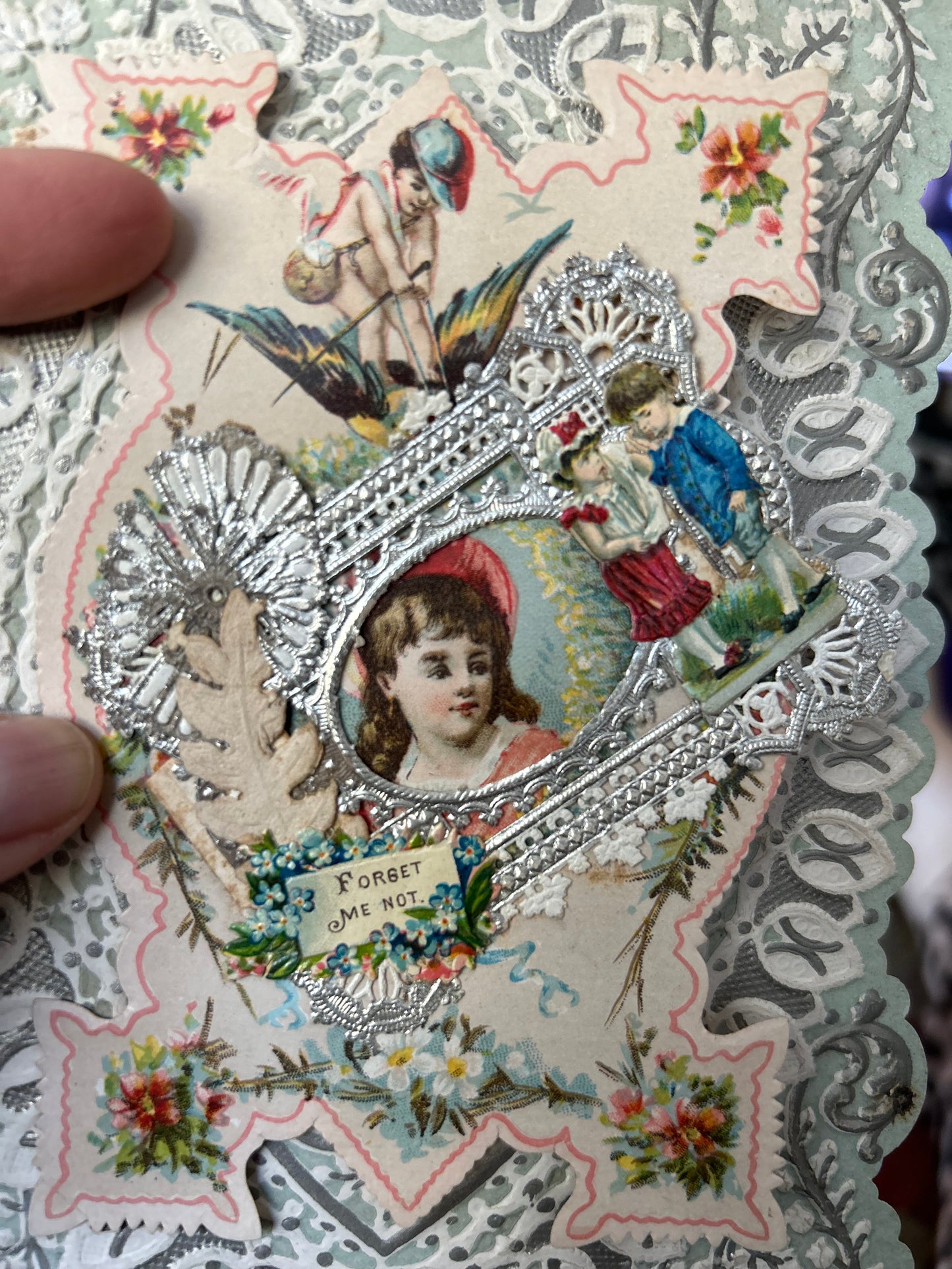 A Very Fanciful Antique Valentine Boy cherub flying on a Bird